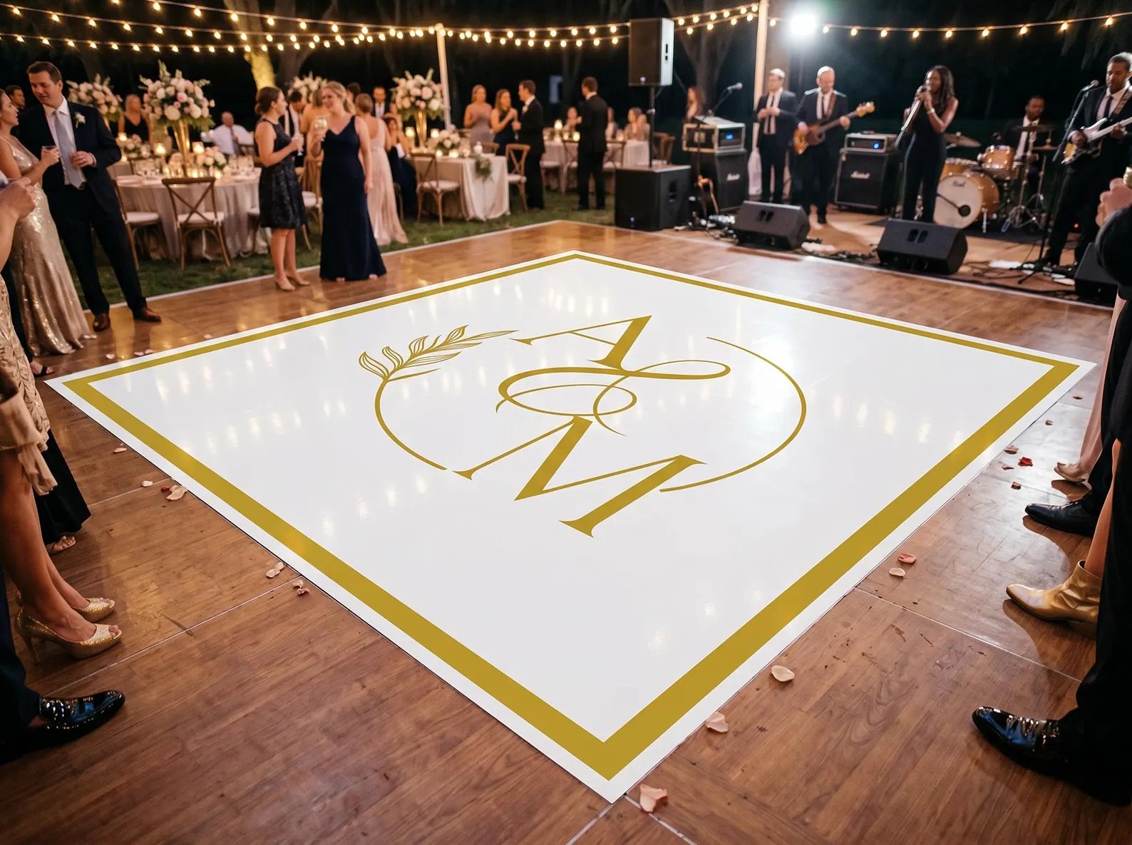 Custom printed vinyl wrap dance floor with couple's initials at a New Orleans wedding